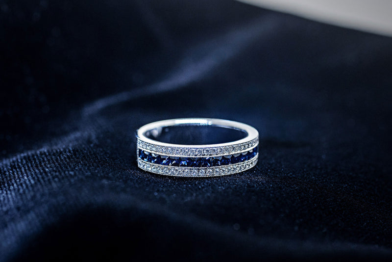Blue sapphire channel band with diamond rows in 14K white gold