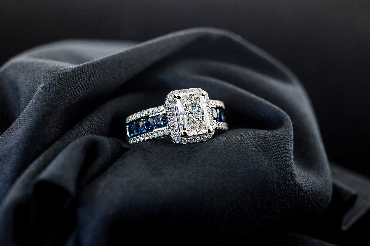 Blue sapphire and diamond engagement ring in 14K white gold