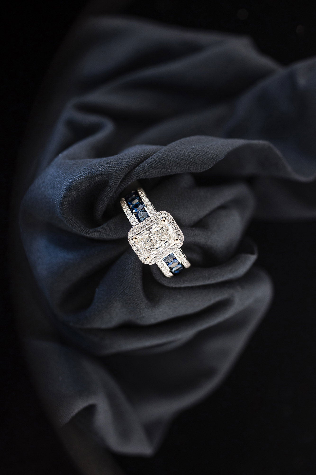 Blue sapphire and diamond halo engagement ring, top view