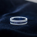 Blue sapphire channel band with diamond rows in 14K white gold