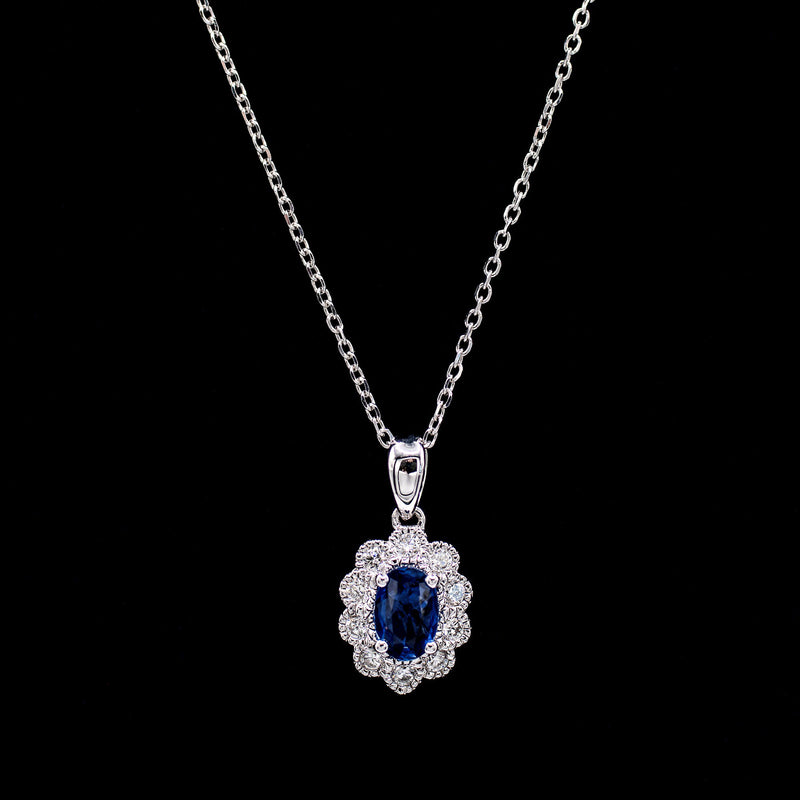 Blue sapphire pendant surrounded by a scalloped diamond halo in 14K white gold — Gent Jay Jewelry Blue Line Collection